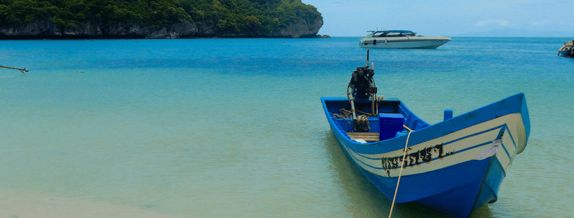 a thailand boat in the harbour of a beautiful thailand island