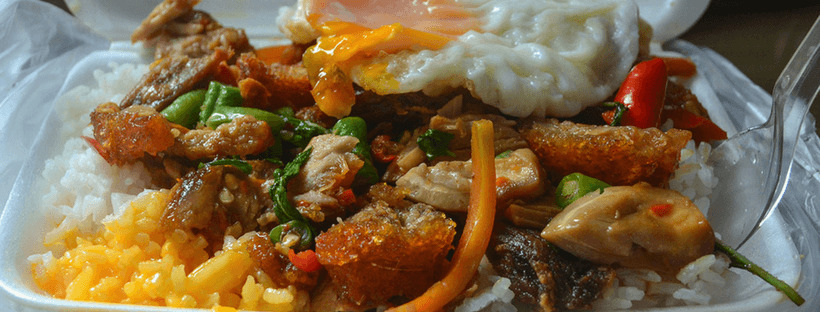 Kaprao Moo Grob - Delicious Thai street food consisting of crispy pork belly and holy basil