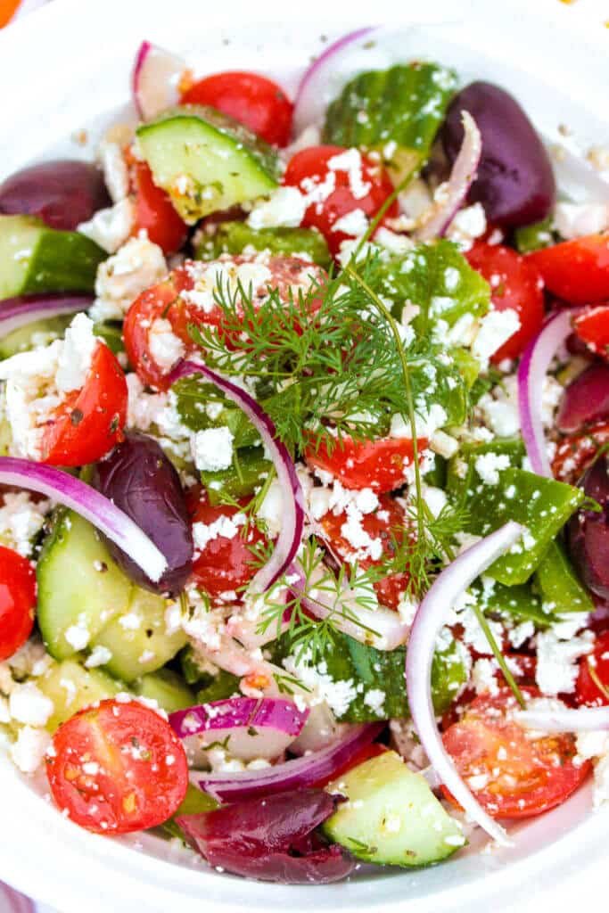 This easy Greek salad is one of my favorite authentic Greek recipes! It comes out fresh and delicious every time. #gayglobetrotter #greeksalad #salad #greekrecipe #tomato #cucumber #greek
