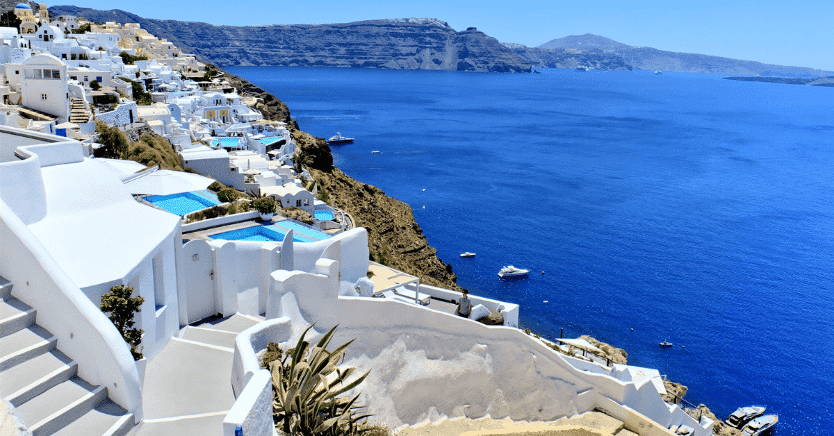 Santorini architecture and blue waters.