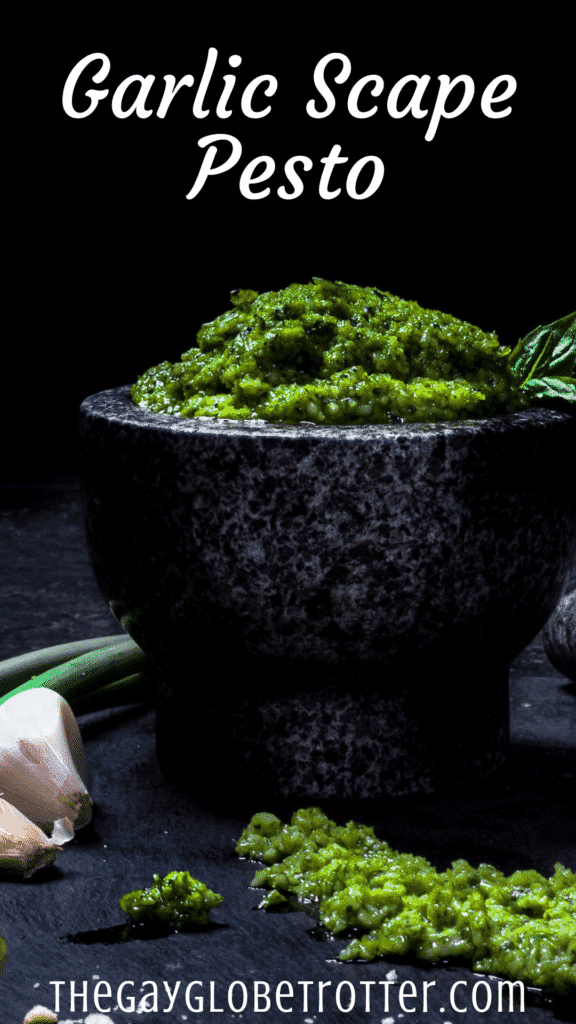 Garlic scape pesto in a bowl with text overlay that reads "garlic scape pesto"