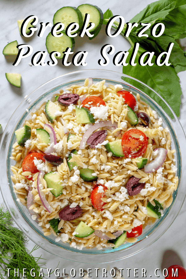 A bowl of Greek orzo pasta salad with text overlay that reads "Greek orzo pasta salad"