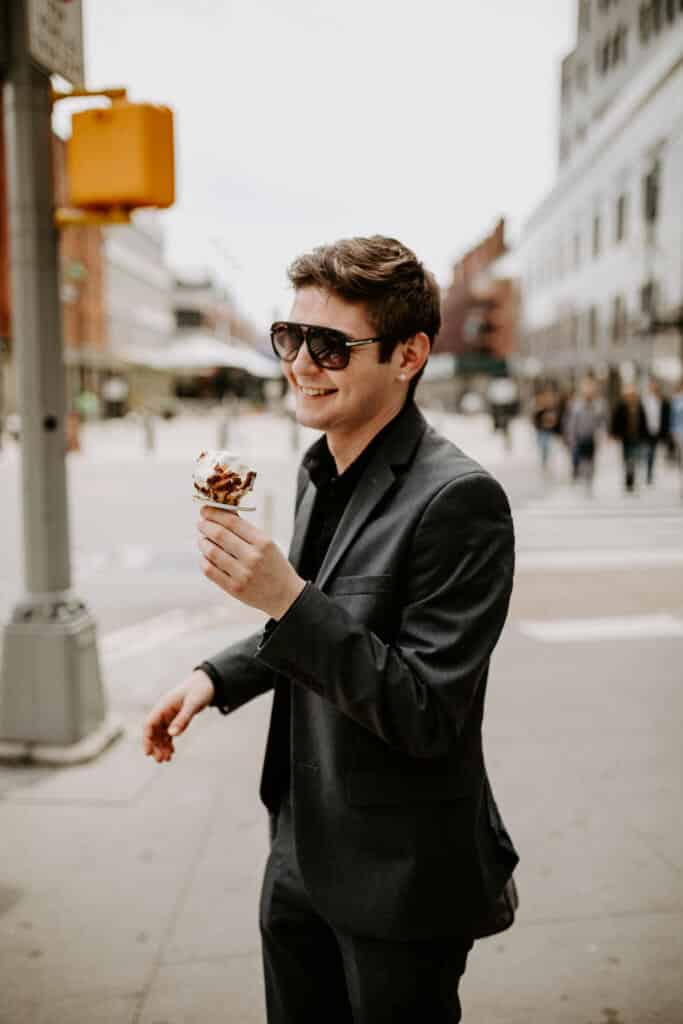 A man eating ice cream in Manhattan, New York City.