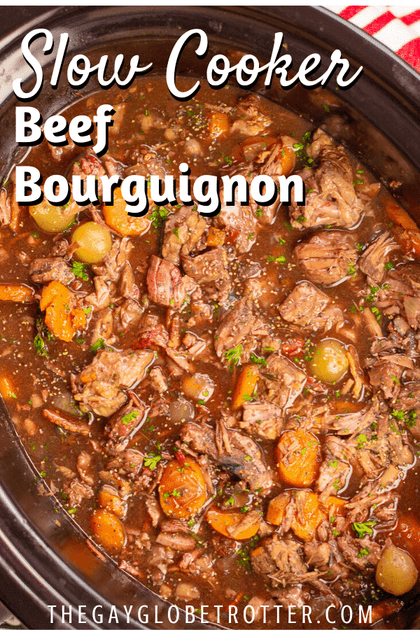 Beef bourguignon in a slow cooker with text overlay that says "slow cooker beef bourguignon"