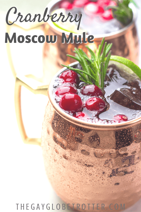 A close up of cranberrry moscow mules with text overlay that says "Cranberry Moscow Mule".