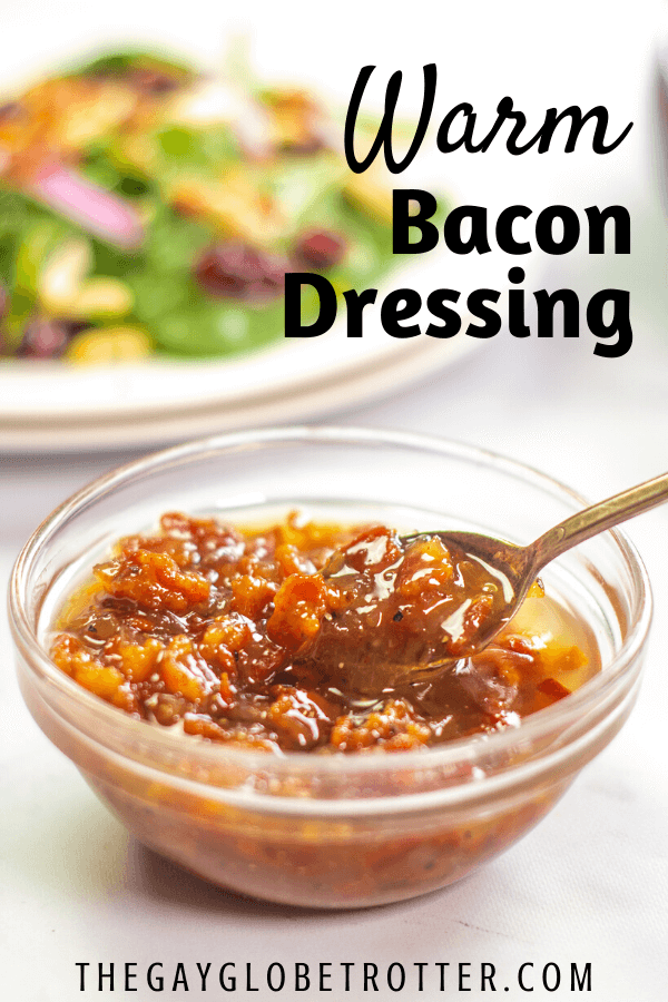 Warm bacon dressing in a serving bowl with a spoon.