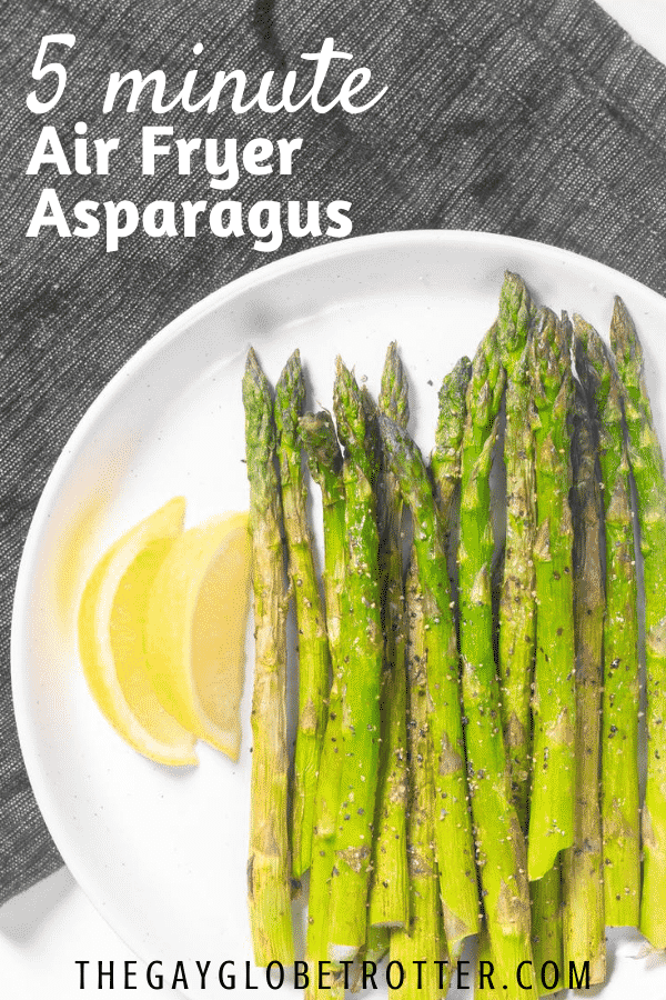 A plate of air fryer asparagus with text overlay that says "5 minute air fryer asparagus".