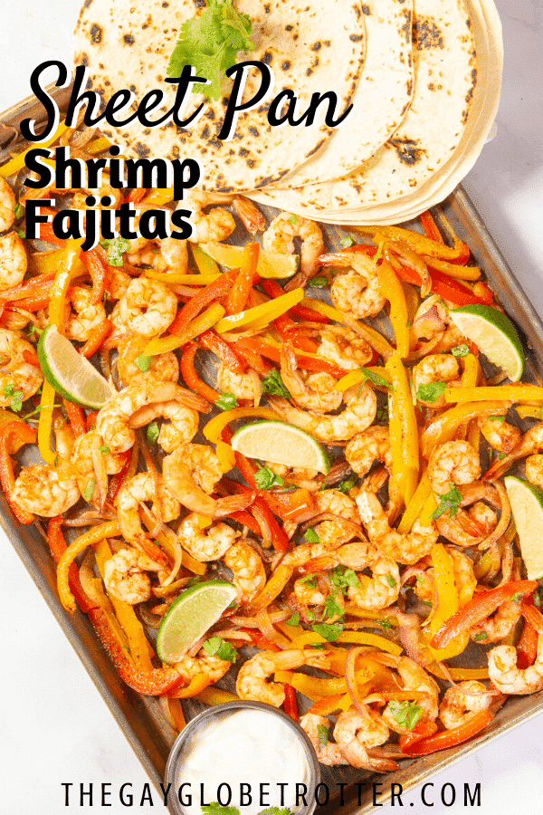A sheet pan of shrimp fajita filling with text overlay that reads "sheet pan shrimp fajitas"