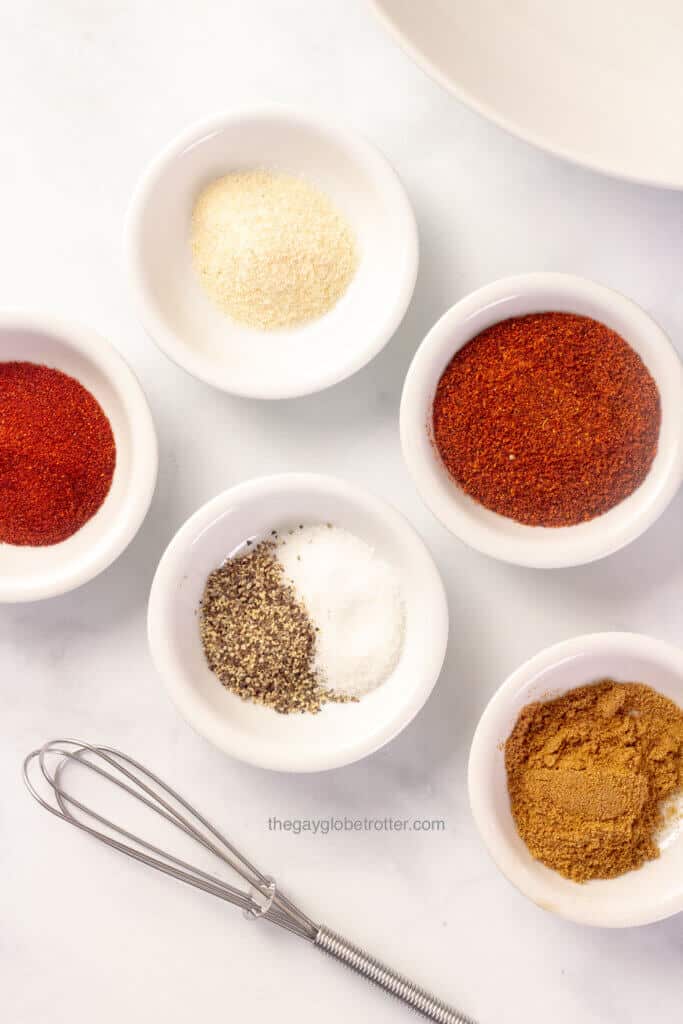 Different spices in ramekins ready to be mixed into fajita seasoning.