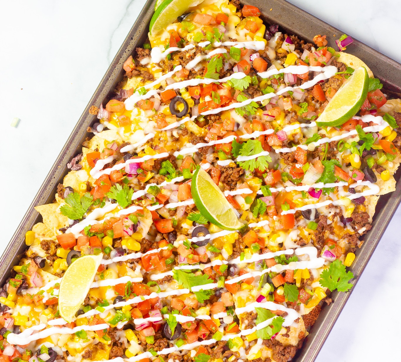 https://www.thegayglobetrotter.com/wp-content/uploads/2020/08/sheet-pan-loaded-nachos-4.jpg