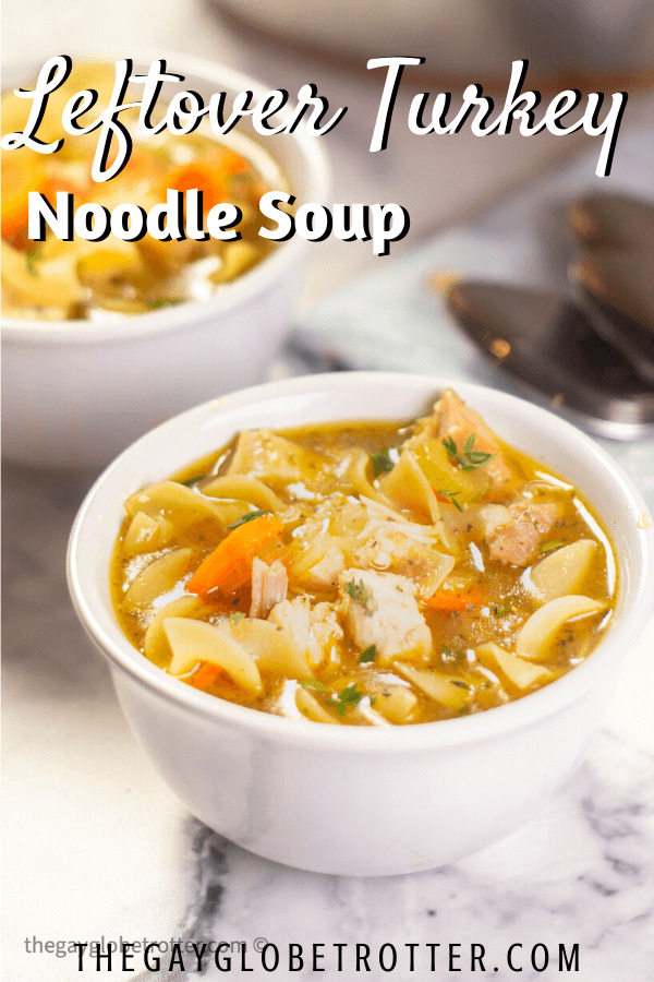 A bowl of turkey noodle soup with text overlay that reads "leftover turkey noodle soup".