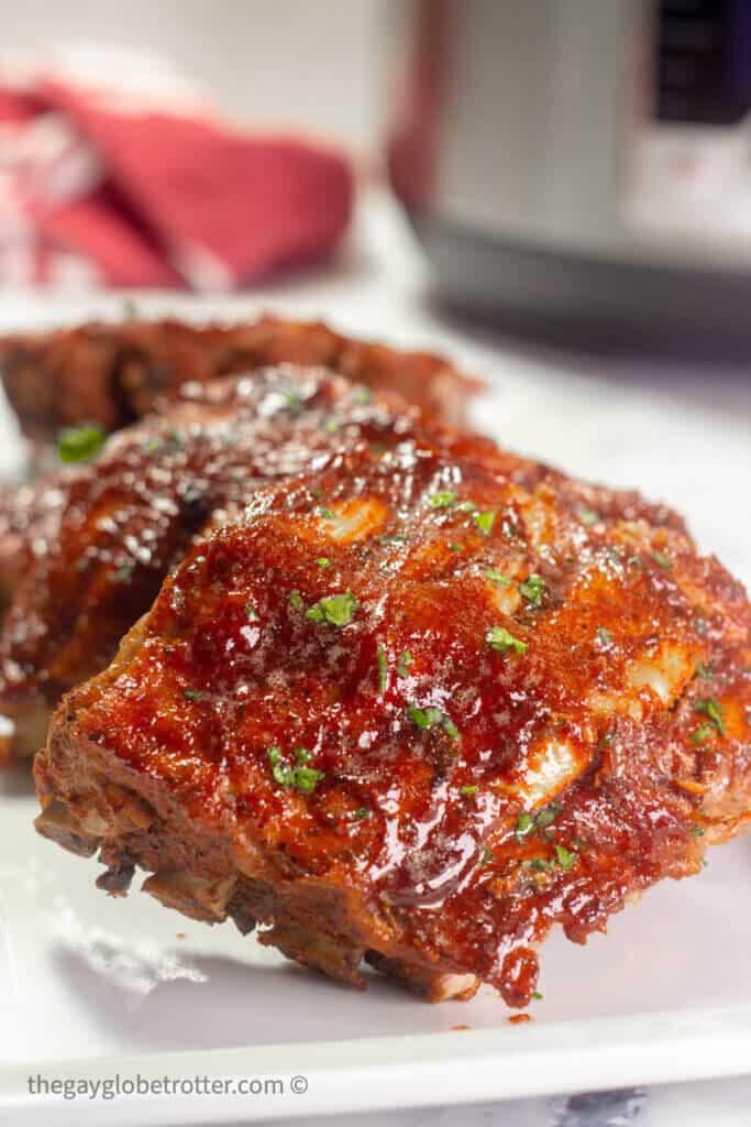 Instant Pot ribs on a white serving plate.