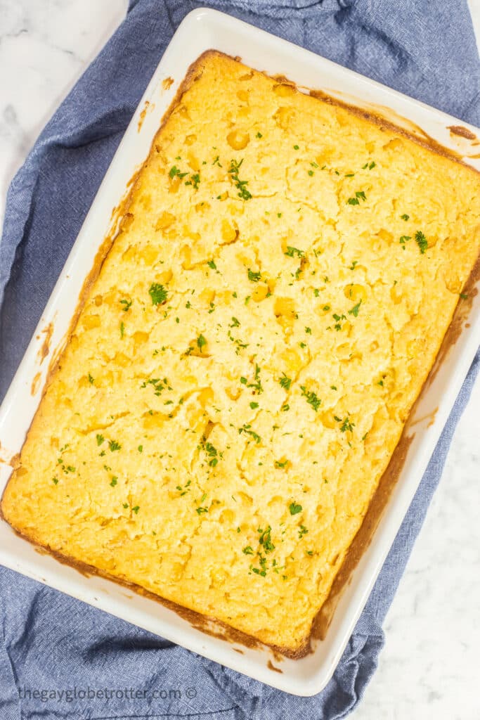 Jiffy corn casserole topped with fresh parsley.