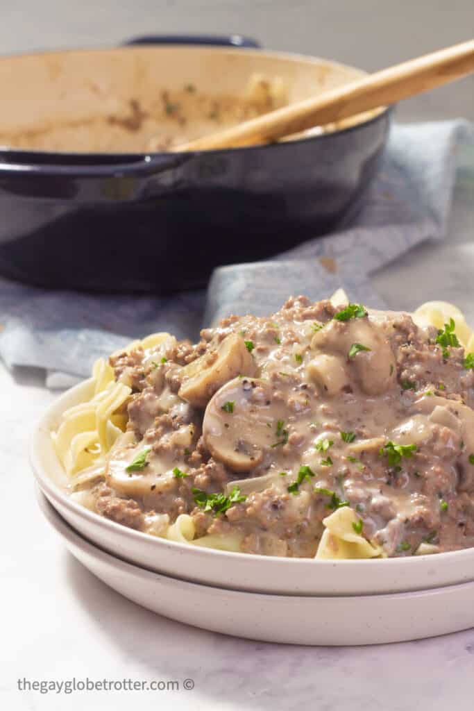 A plate of ground beef stroganoff on egg noodles.