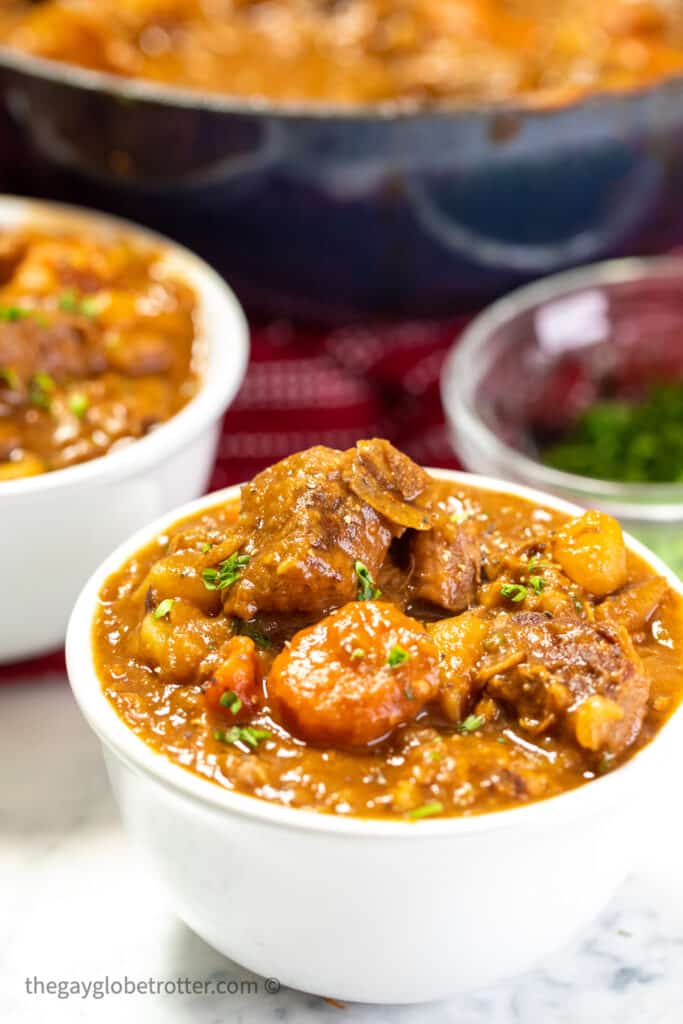 A bowl of Irish Guinness stew topped with parsley.