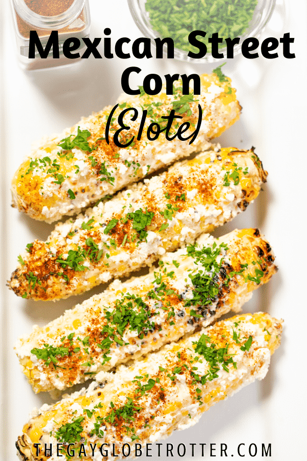 Mexican street corn on a plate with text overlay.
