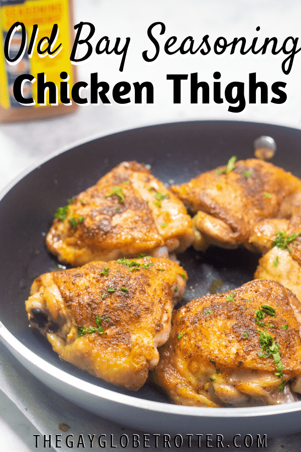 Old bay chicken thighs in a black pan with text overlay.