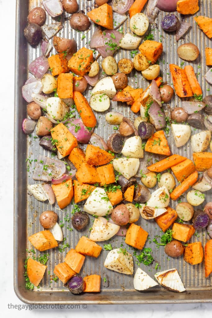 Roasted root vegetables topped with parsley.