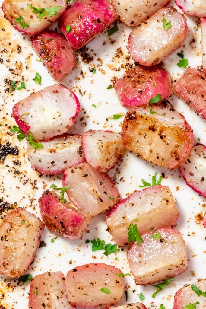 A close up of roasted radishes with spices.