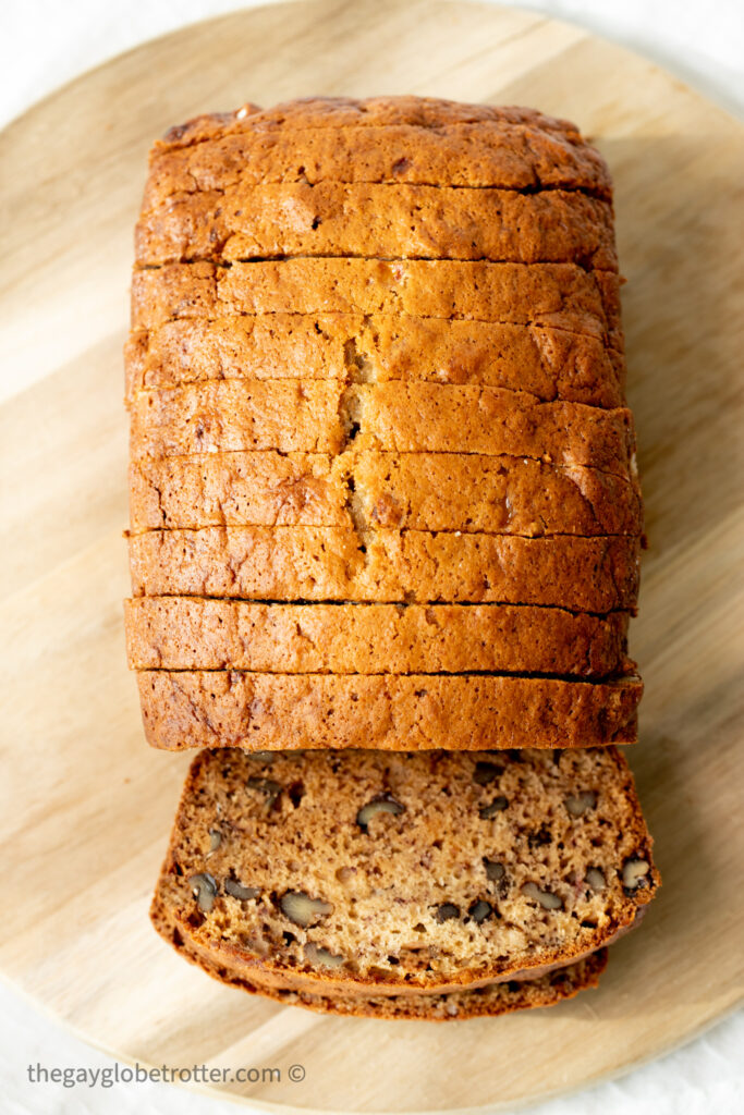 Banana bread sliced on a serving plate.