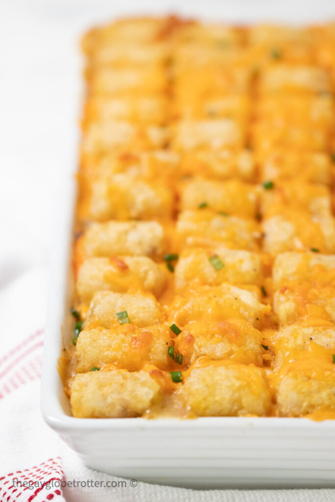 Tater tot casserole fresh from the oven topped with chives.