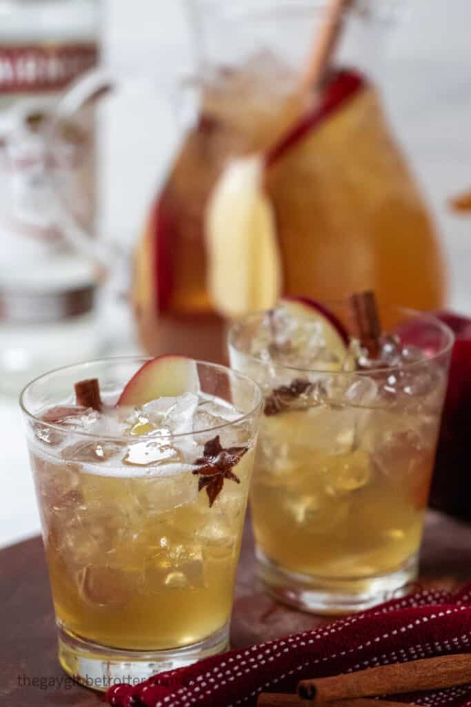 Two glasses of Thanksgiving punch on a wood board.