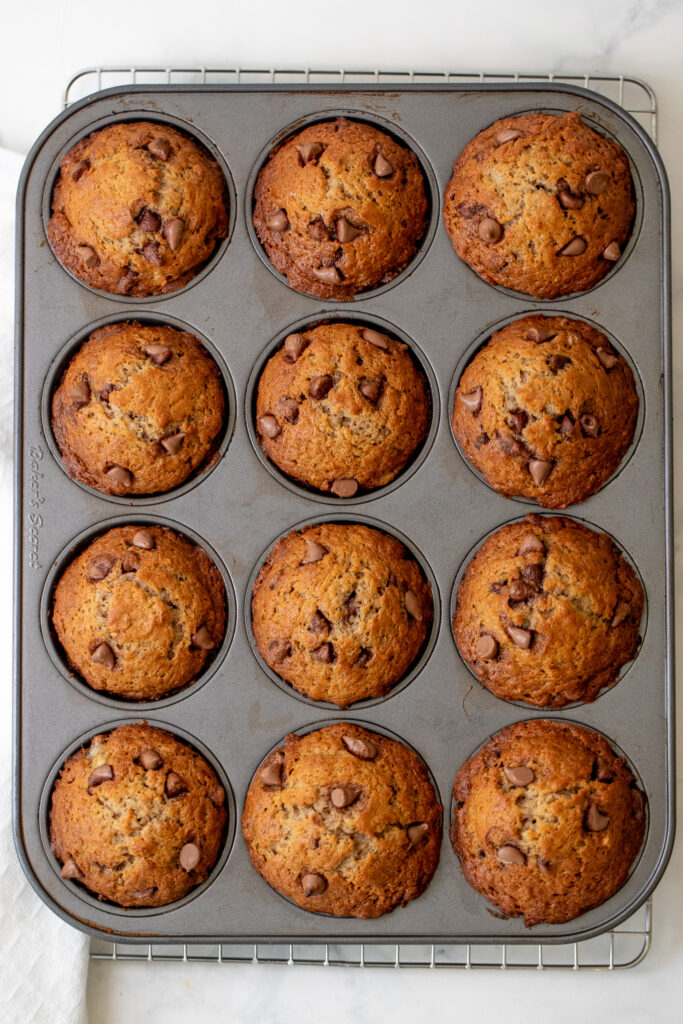 A muffin tin of banana chocolate chip muffins.