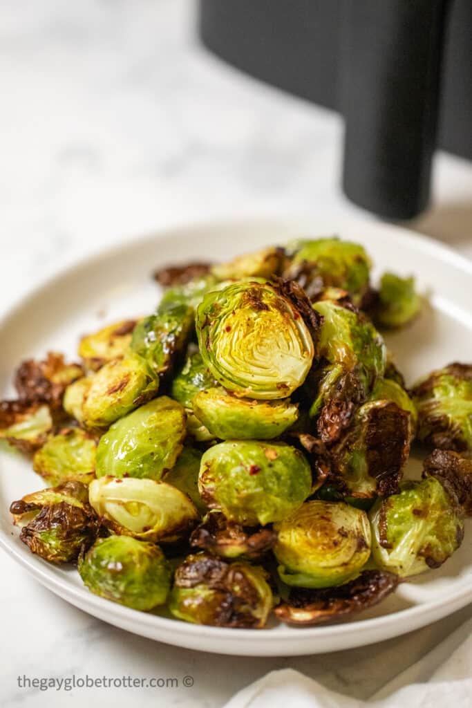 A serving plate of air fried brussels sprouts.