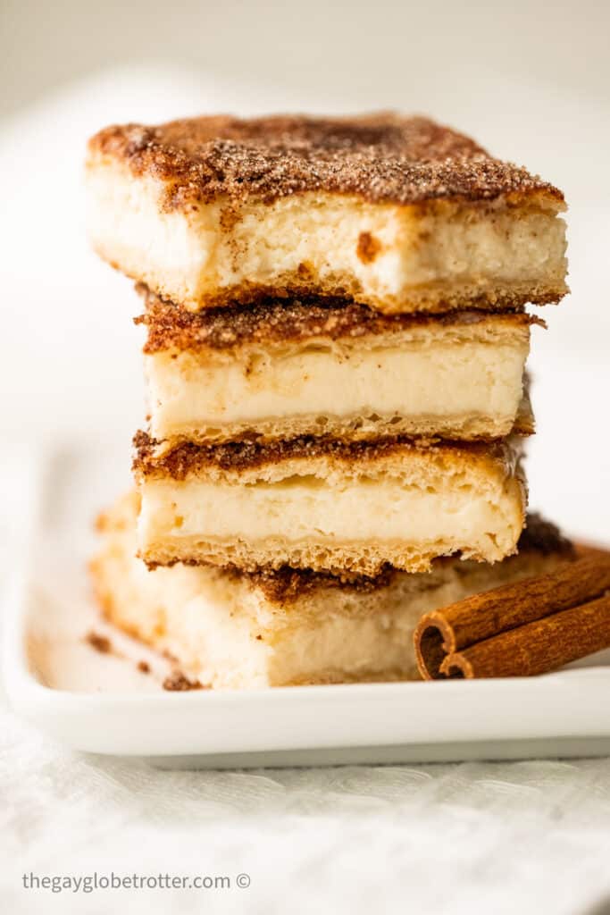 A stack of churro cheesecake bars.