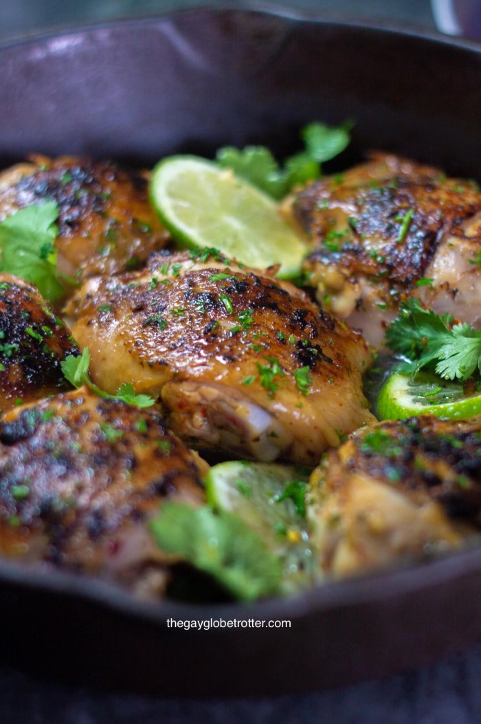 A close up of a cilantro lime chicken thigh in a pan